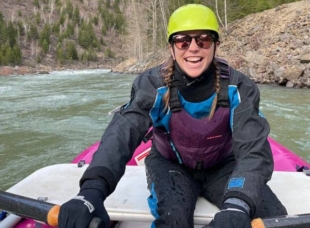 Adventure Office Software employee enjoys her kayak trip down choppy waters