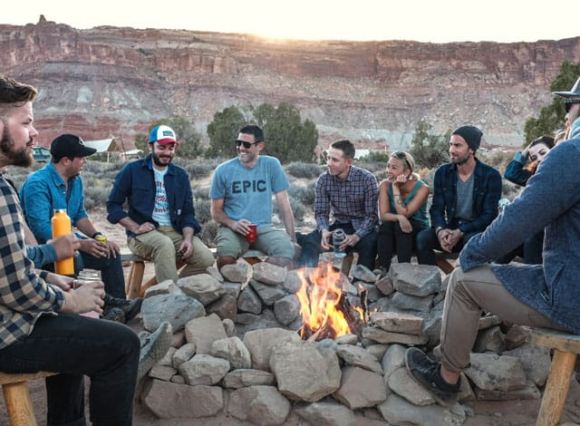 Adventure Office Software group of friends at controlled campfire after hiking